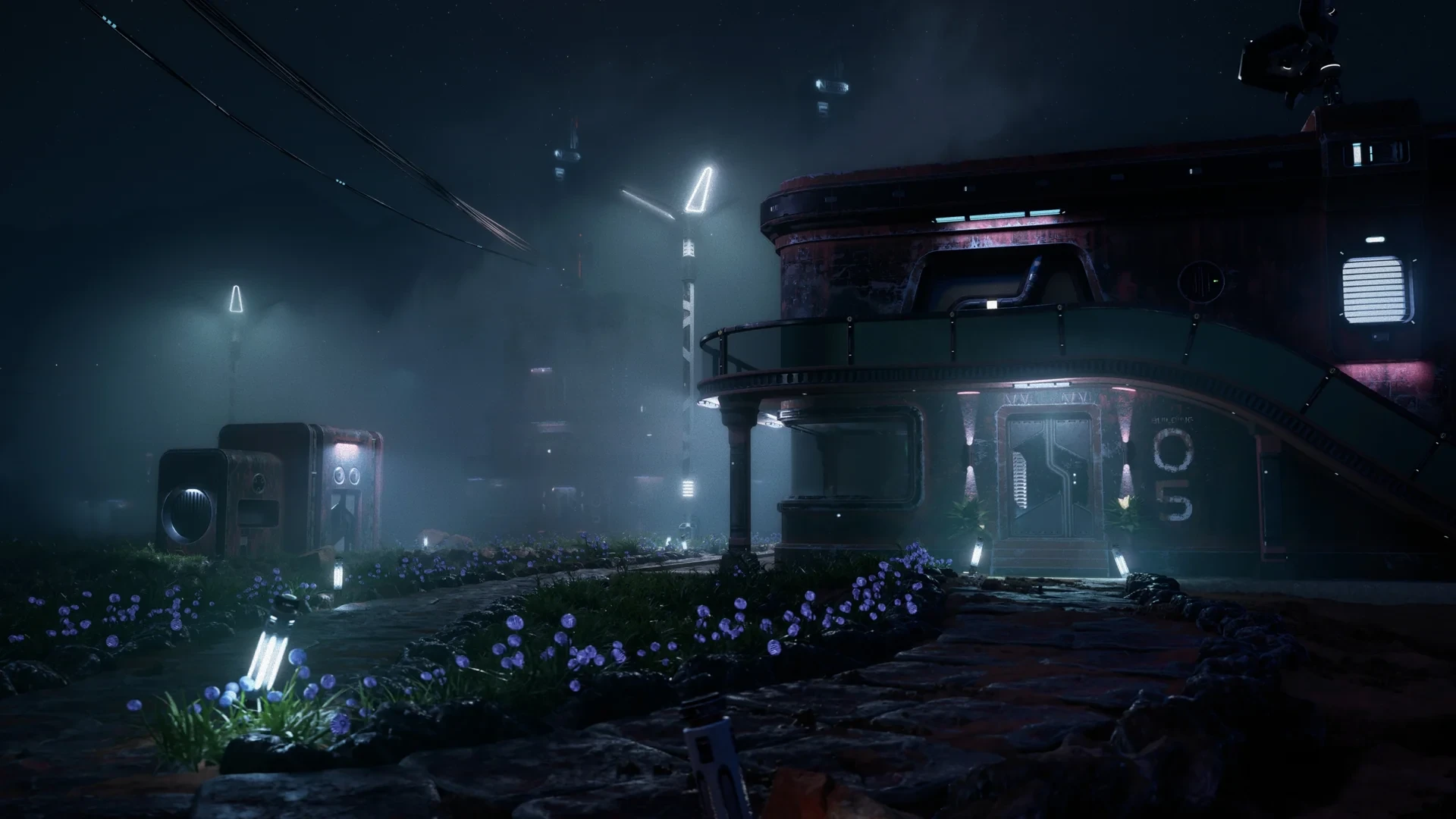Rounded outpost building and small utility pods beside a foggy path lined with purple flowers