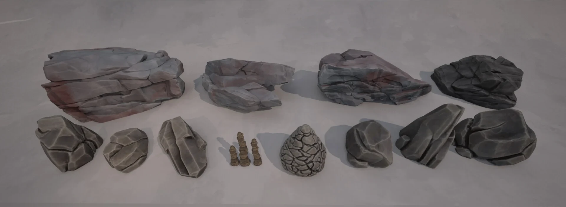 Complete lineup of stylized rock formations, boulders, and stacked stone cairns